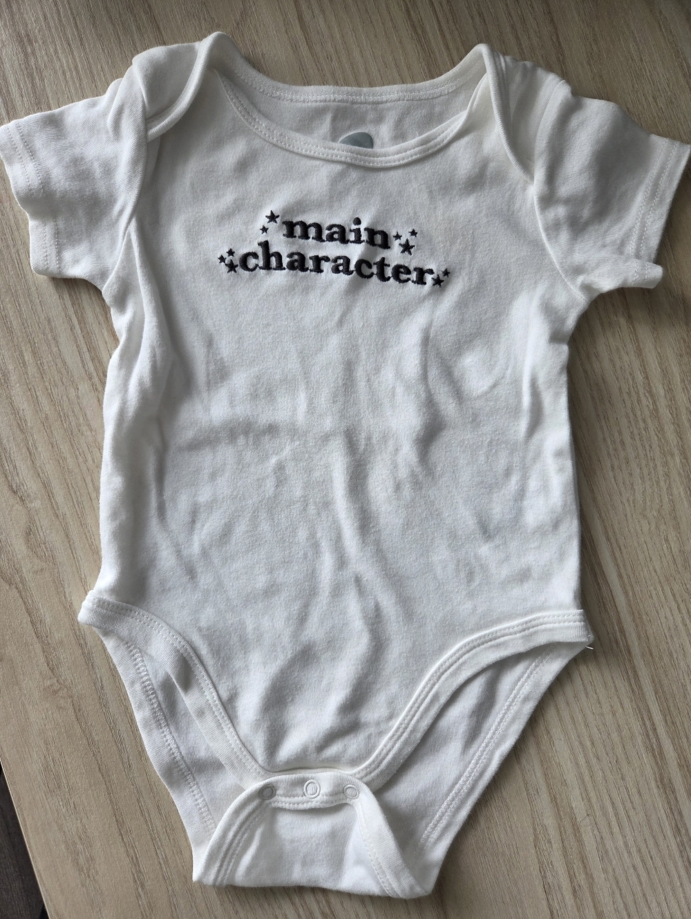 White "main character" Cotton Baby One-Piece Bodysuit - Like New
